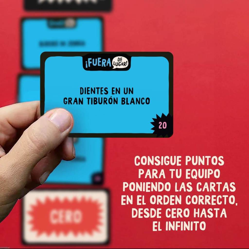 hand holding a card with other cards in the background